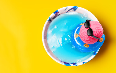 Pink Brain Floating in Cup Pool with Inflatable Ring