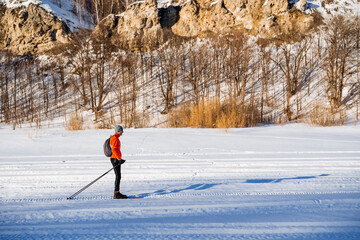Cross country skiing on frozen lake, enjoying nature and terrain
