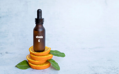 Vitamin C serum with orange fruit