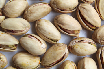 Background texture of salted pistachio, flat lay or top view