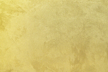 Texture of golden decorative plaster or concrete. Abstract gold grunge background.