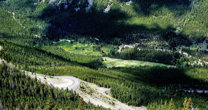 Spectacular view at Beartooth Highway Wyoming. A Drive of incredible beauty. Yellowstone. Alpine mountains covered by snow and green woods. Northwest. Majestic beartooth mountains landscape. Road trip