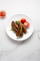 Grilled sausages  and sauces on light surface bbq food