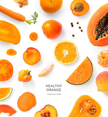 Creative layout made of orange, carrot, papaya, turmeric, tomato, melon, mango, pumpkin, peach and apricot on the white background. Flat lay. Macro concept of green vegetables.