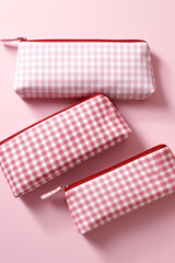 Cosmetic pouches in various sizes featuring gingham patterns сreated with Generative Ai
