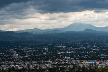 The sprawling cityscape of Mexico City with a mountainous backdrop.