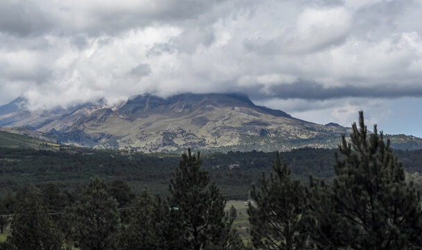 Iztaccihuatl, a stratovolcano in central Mexico, rises into the clouds.