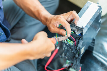 Technician checked dirty air conditioning control board, Repairman fixed air conditioning systems, Technician man service repair and maintenance of air conditioners