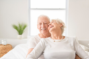 Senior 80 years old Couple Relaxing In Bed together