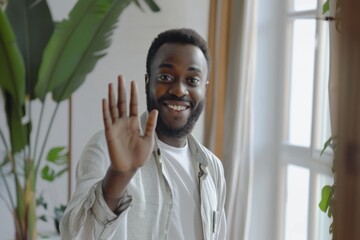 Front person view of african american man in shirt waving hello while starting video call in apartment. Friendly male greeting and welcoming interlocutor at beginning of conversation, Generative AI