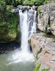Waterfall, typical of Bali in the forest, drone photo in summer