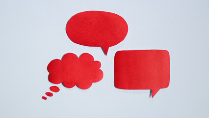 Red paper speech bubble on white background. Blank space that can be added text.