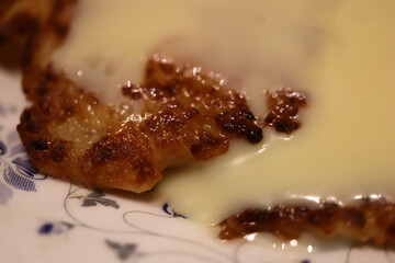 Fried cheesecakes sprinkled with condensed milk