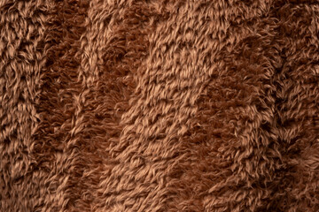 Texture of a brown faux fur as a background.