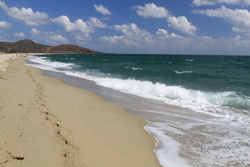 Fototapeta premium Turquoise sea water and blue sky in the beautiful beach of Su Tiriarzu in La Caletta, Siniscola in Sardinia, Italy