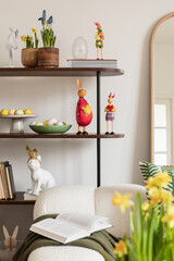 Sunny and design interior of living room with easter decorations, tulips, modular sofa, shelf,...