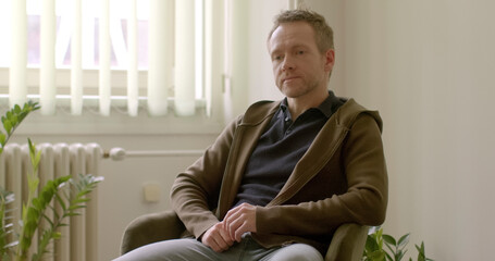 Portrait of contemplative, silent man. Lost in thoughts, gaze distant yet intense, as if delving...