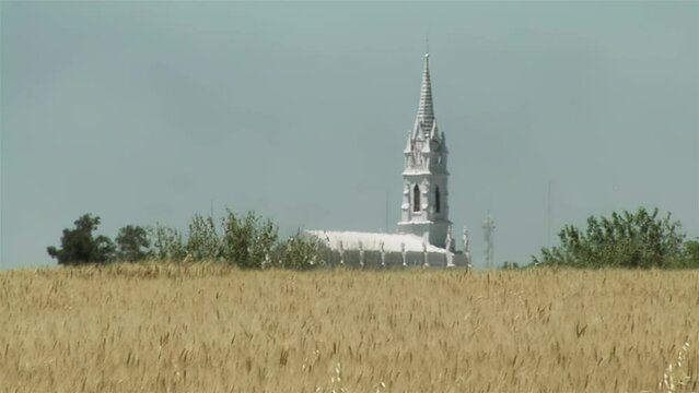 A Wheat Field and the Dome of a Church in the Distance in the Province of Entre Rios, Argentina. 