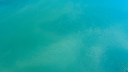Fototapeta na wymiar Surface of the blue water of a lake. Ideal for sea and ocean texture and pattern.