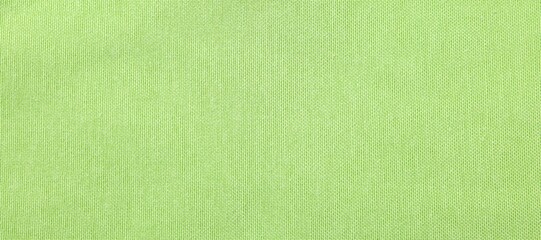Texture of light green fabric as background, top view