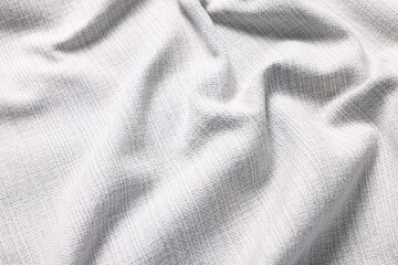 Texture of white crumpled fabric as background, closeup