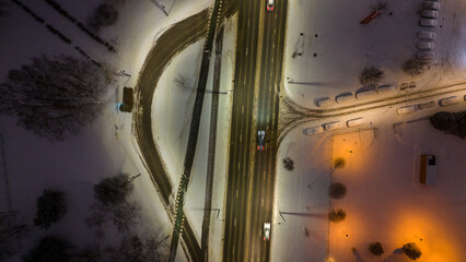 Drone photography of a bus stop near a road road in a city during winter morning - Powered by Adobe