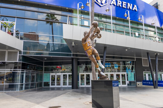A bronze statue of the LA Lakers basketball player Elgin Baylor in front of Crypto.com Arena in Los Angeles California USA