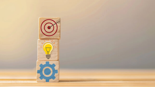 Stacked Wooden Blocks with Icons of a Target, Light Bulb, and Gear on Gradient Background
