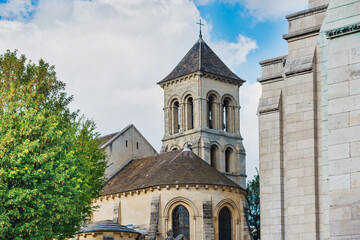 Fototapeta na wymiar Church of Saint Peter of Montmartre with tower. Montmartre hill, Paris, France