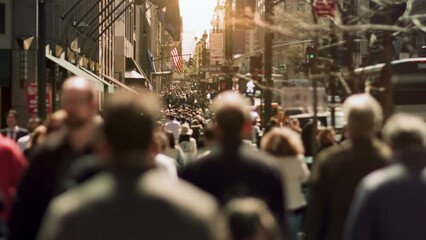 Crowded avenue. New York City. US. People walking in busy street of Manhattan. Traffic passing by. 