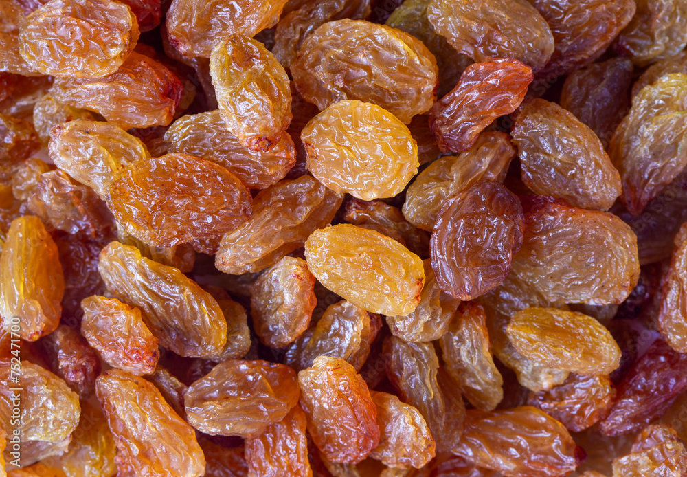 Wall mural Dried grapes on a white background. Dried Sultani grapes.