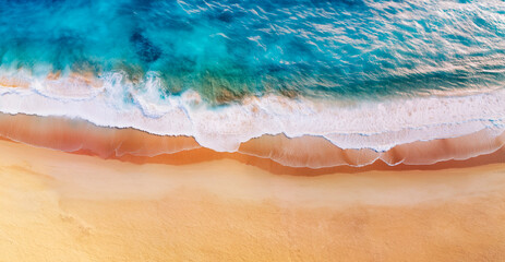 Fototapeta na wymiar Aerial drone view of a desert beach with turquoise water.