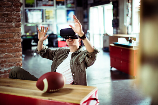 Young man using a vr headset in a startup company office