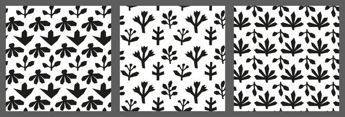 Set of seamless patterns with cut out flowers, leaves and twigs.