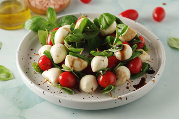 A plate with Italian salad caprese canape	