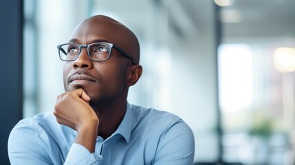 Thoughtful Black Businessman Contemplating Future Strategies in Modern Office Setting