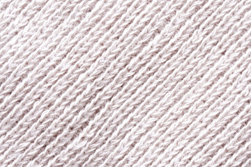 Cosy backdrop or background in textured warm light beige textile material. Cotton and wool. Diagonal fibres. Photo. Macro