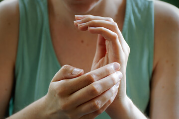 Person practicing EFT. Female tapping karate chop point.