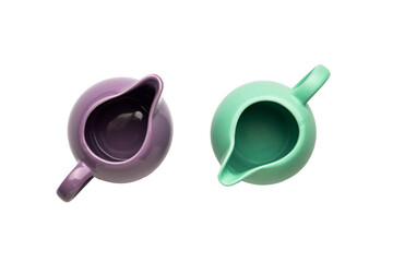 Ceramic saucepans and milk jugs for the kitchen on a white background isolated 
