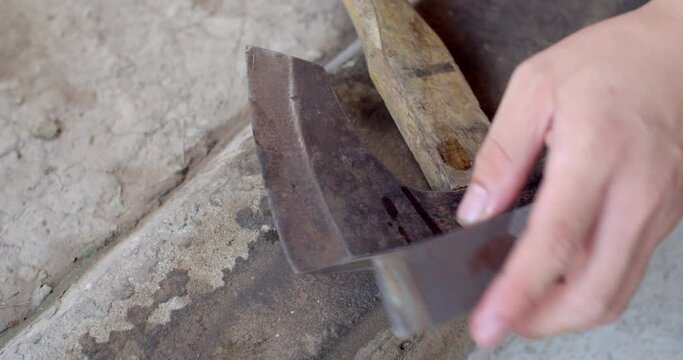 Sharpen your axe to make it look like new. Remove rust from an axe.Old ax full of rust.