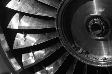 Turbine rotor. Turbojet engine close up black and white photo