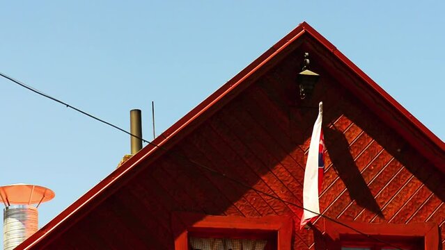 Flag of Slovakia under roof of house