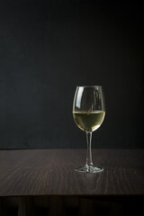 Strong drinks in three glasses on a wooden board with snacks