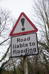 Road liable to flooding sign. warning sign to motorists during heavy rainfall. caution sign