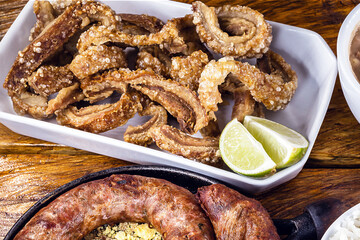 Typical food table in the interior of Brazil. Pork, beans, bean tutu, pork rinds, rice and farofa. Mining food, made at home. Flavors of Brazil.