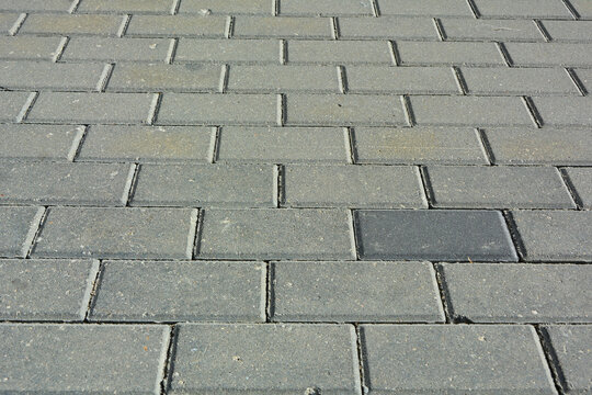 szara kostka brukowa, szare tło, betonowe, szare płyty chodnikowe na miejskiej drodze ulicznej, gray paving stones, gray background, concrete paving slabs, Gray paving slabs in urban street road,
