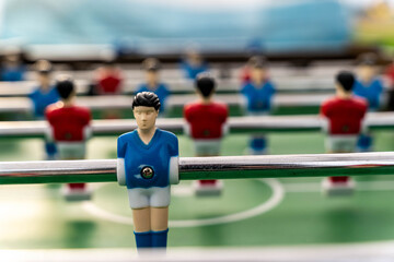 Close-up of figures of plastic players in a football match.