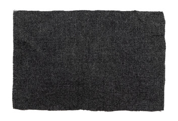 A piece of torn black fabric on a white background. Dark isolate material for sewing clothes