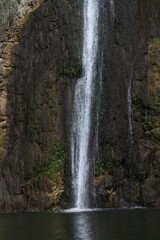 Waterfall cascade on mountain rocks

