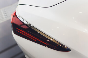 Car detail. New led taillight by night. The rear lights of the car, in hybrid sports car. Developed...